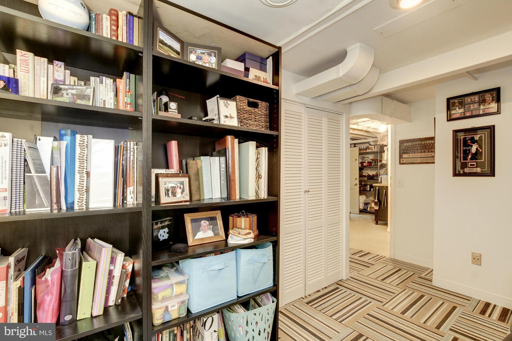 9917 Big Rock Road Silver Spring, MD 20901 - Photo 18 of 24 a view of walk in closet with clothes and shoes