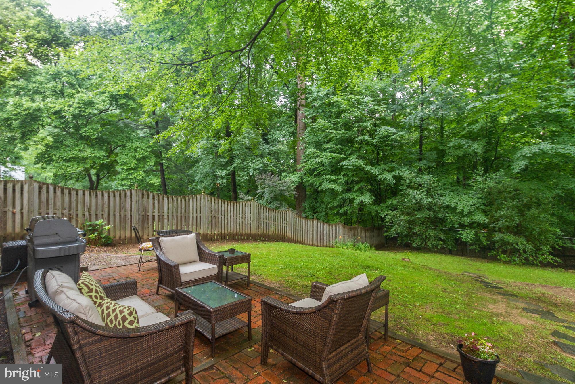 9917 Big Rock Road Silver Spring, MD 20901 - Photo 22 of 24 a view of a patio with couches chairs and a yard