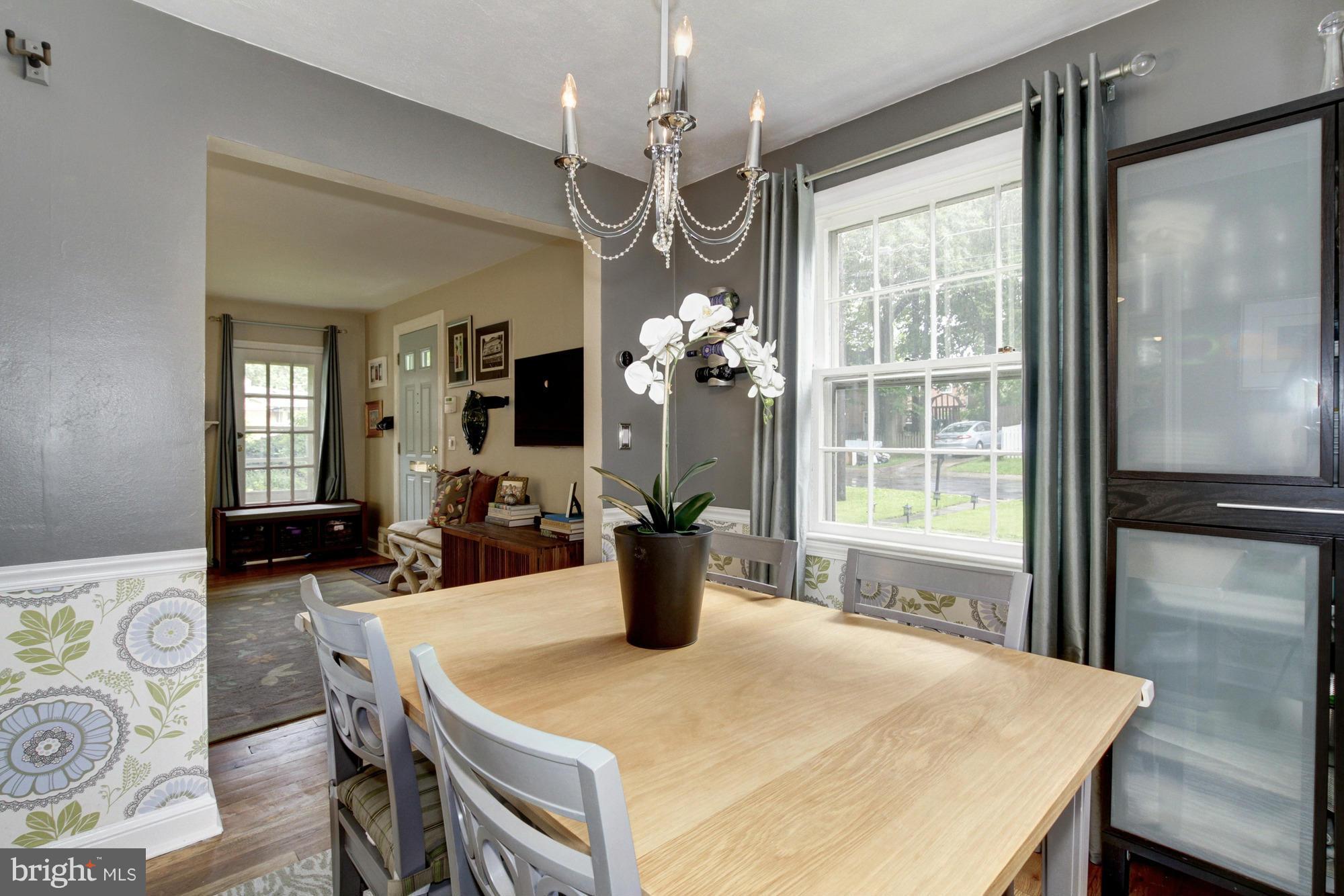 9917 Big Rock Road Silver Spring, MD 20901 - Photo 6 of 24 a view of a dining room with furniture window and wooden floor