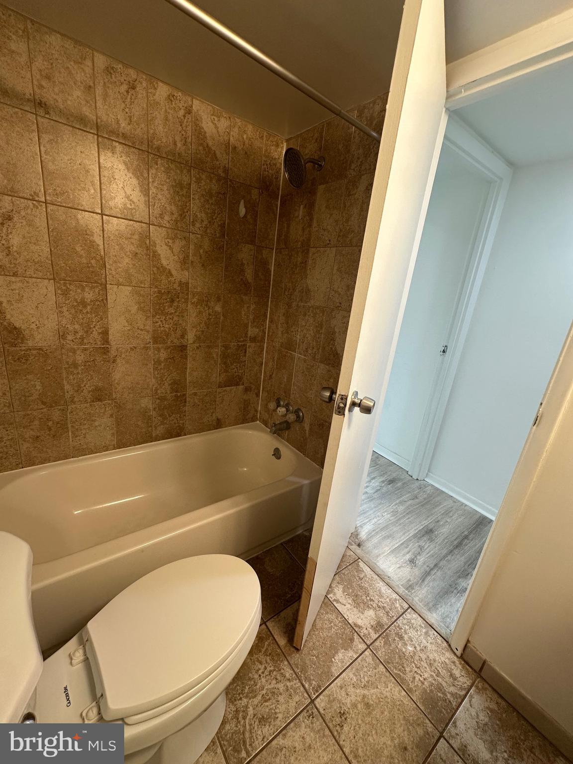 3722 Bel Pre Road, Unit 12 Silver Spring, MD 20906 - Photo 18 of 26 a bathroom with a toilet and a bathtub