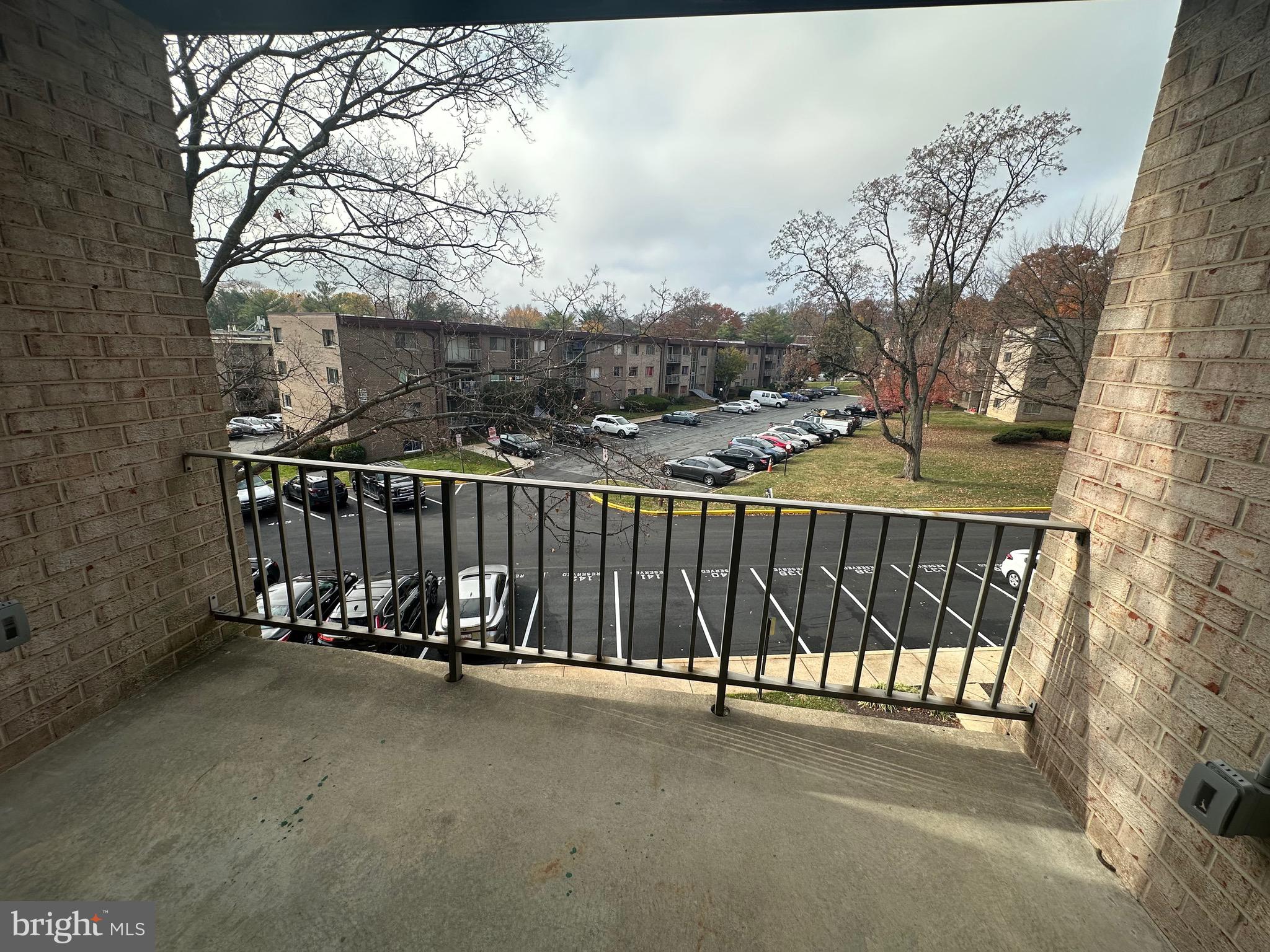 3722 Bel Pre Road, Unit 12 Silver Spring, MD 20906 - Photo 22 of 26 a view of a roof deck with wooden fence and floor