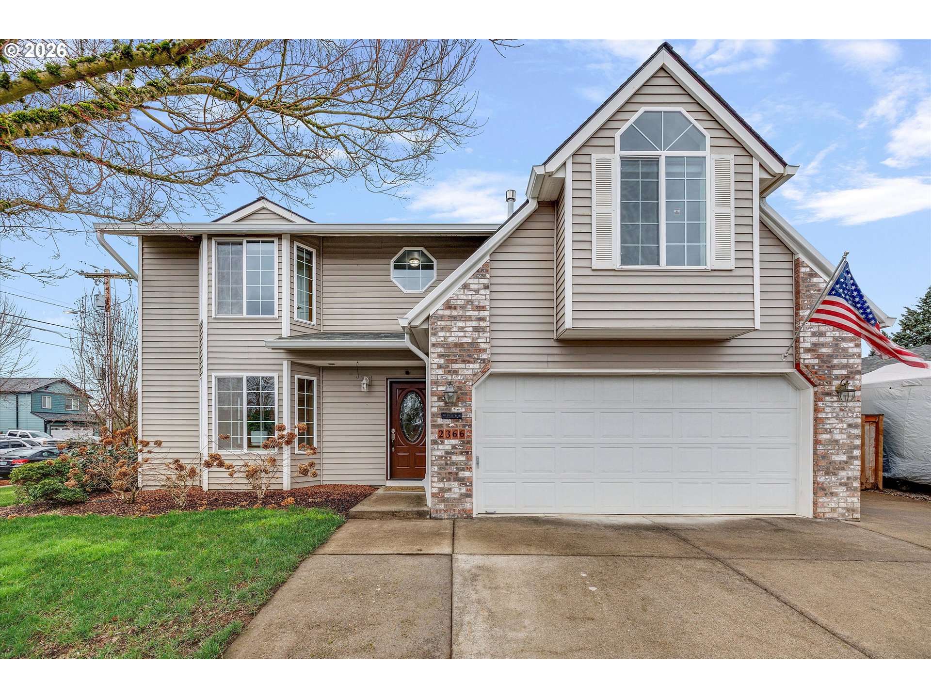 2366 Baines Boulevard Hubbard, OR 97032 - Photo 1 of 48 a front view of a house with a yard