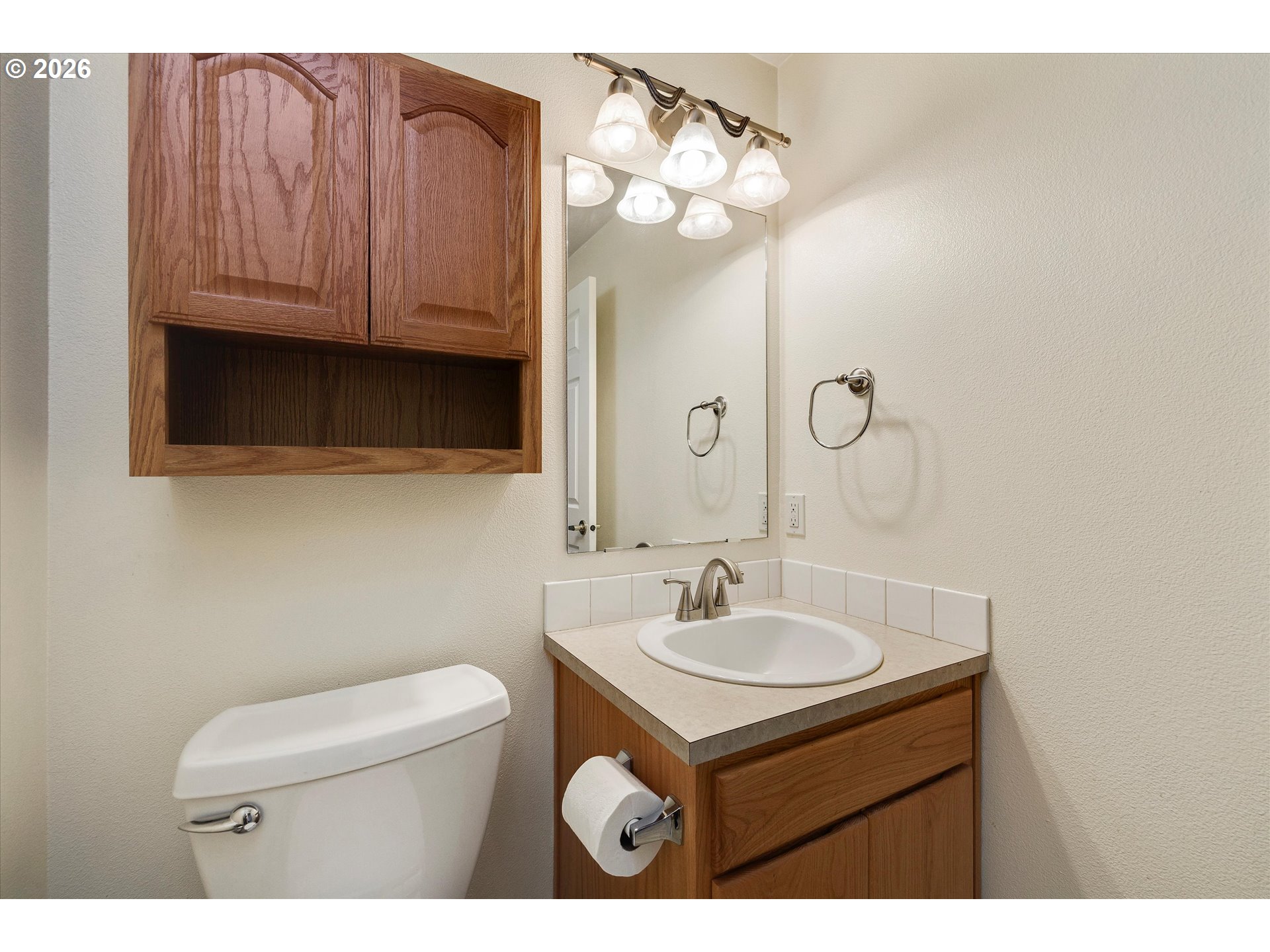 2366 Baines Boulevard Hubbard, OR 97032 - Photo 17 of 48 a bathroom with a sink a toilet and mirror