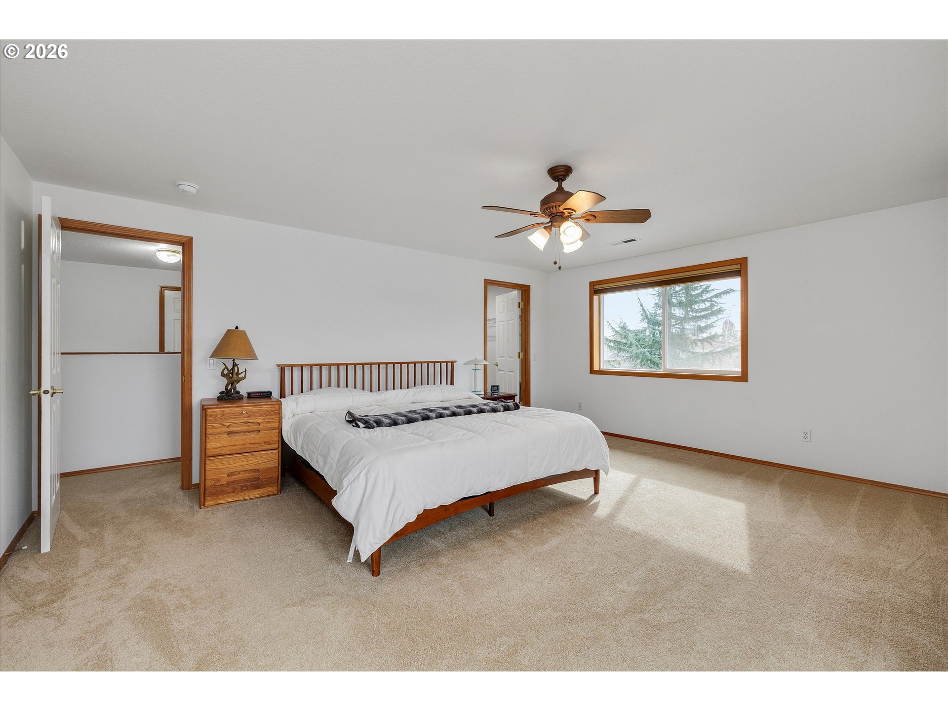 2366 Baines Boulevard Hubbard, OR 97032 - Photo 23 of 48 a bedroom with a bed and a chandelier