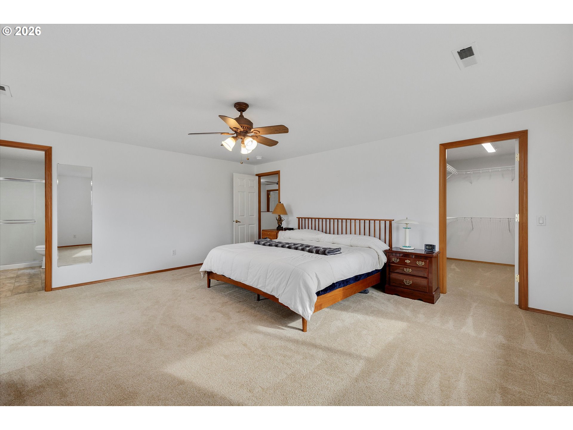 2366 Baines Boulevard Hubbard, OR 97032 - Photo 24 of 48 a bedroom with a bed and a chandelier