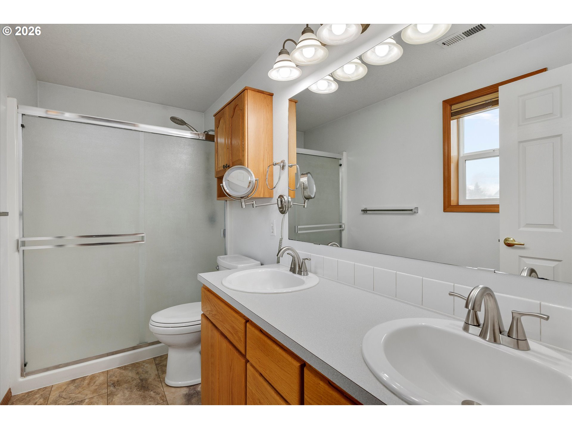2366 Baines Boulevard Hubbard, OR 97032 - Photo 26 of 48 a bathroom with a sink vanity granite and toilet