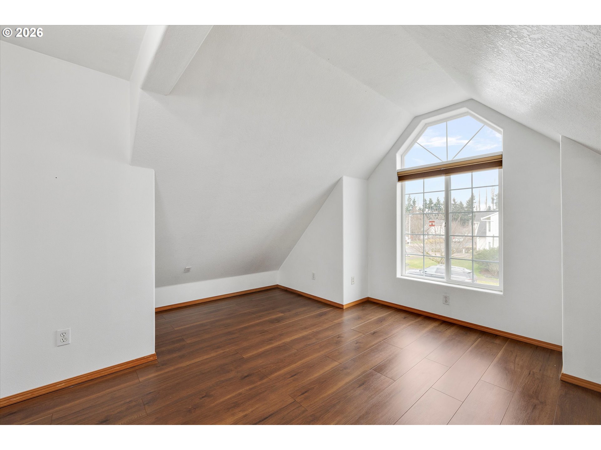 2366 Baines Boulevard Hubbard, OR 97032 - Photo 28 of 48 an empty room with wooden floor and windows