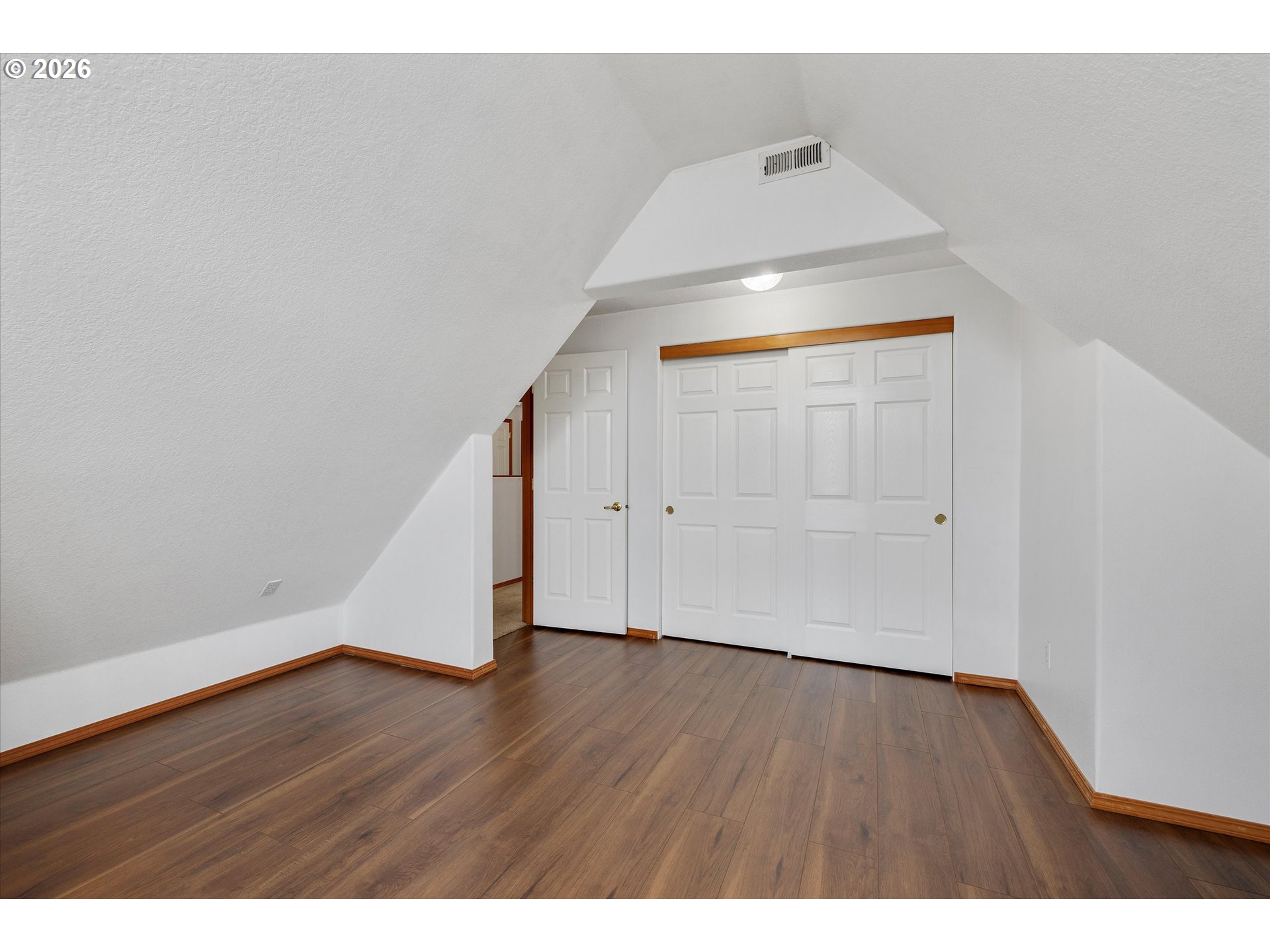 2366 Baines Boulevard Hubbard, OR 97032 - Photo 29 of 48 a view of an empty room with wooden floor