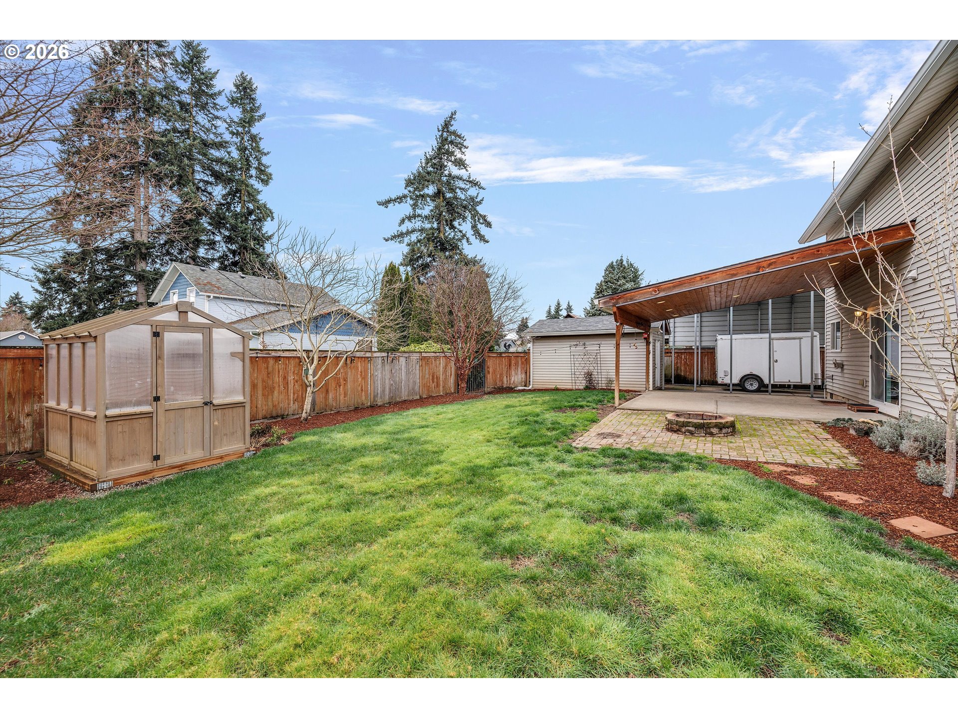 2366 Baines Boulevard Hubbard, OR 97032 - Photo 33 of 48 a front view of a house with a garden