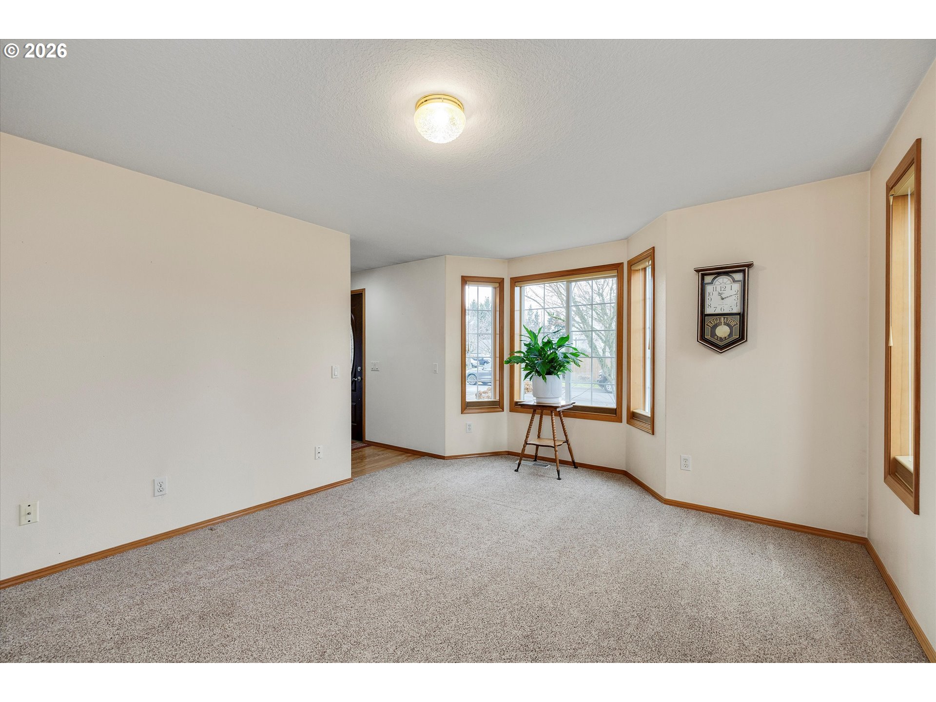 2366 Baines Boulevard Hubbard, OR 97032 - Photo 6 of 48 a view of an empty room with a window