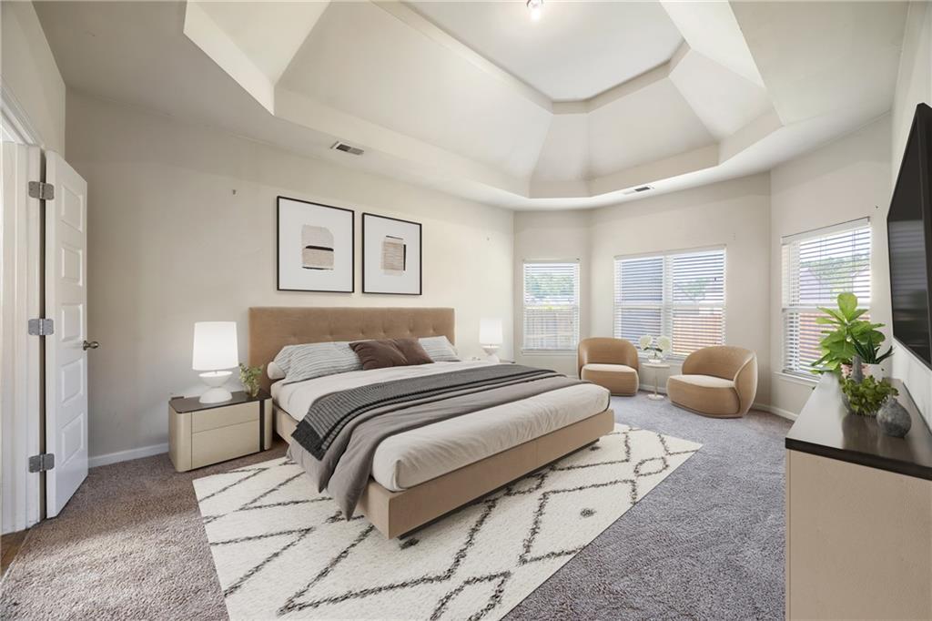 6891 Dresden Drive Rex, GA 30273 - Photo 12 of 26 a spacious bedroom with a bed and glass window