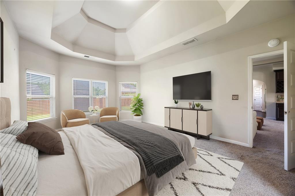 6891 Dresden Drive Rex, GA 30273 - Photo 13 of 26 a bedroom with a flat screen television and a bed