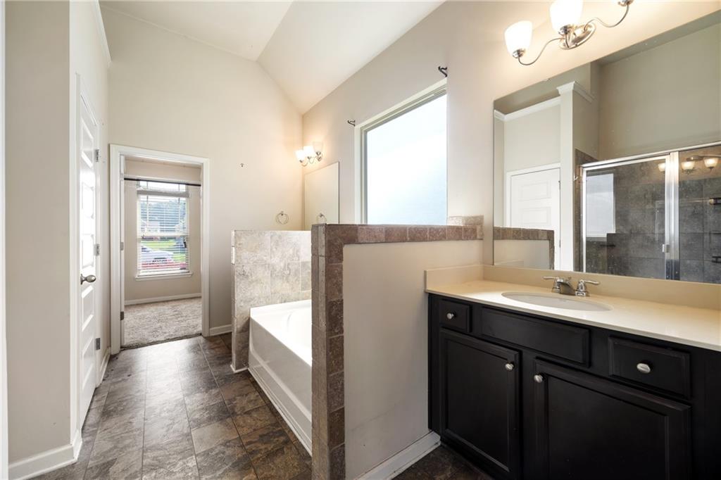 6891 Dresden Drive Rex, GA 30273 - Photo 14 of 26 a en suite bathroom with a sink and mirror