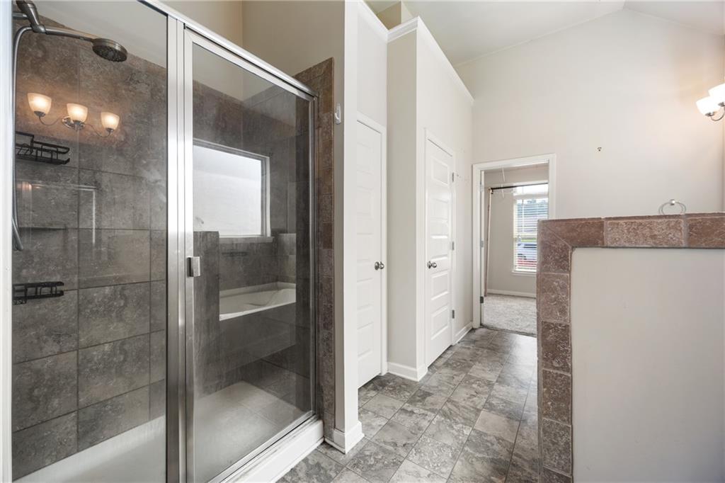 6891 Dresden Drive Rex, GA 30273 - Photo 16 of 26 a bathroom with a glass shower door