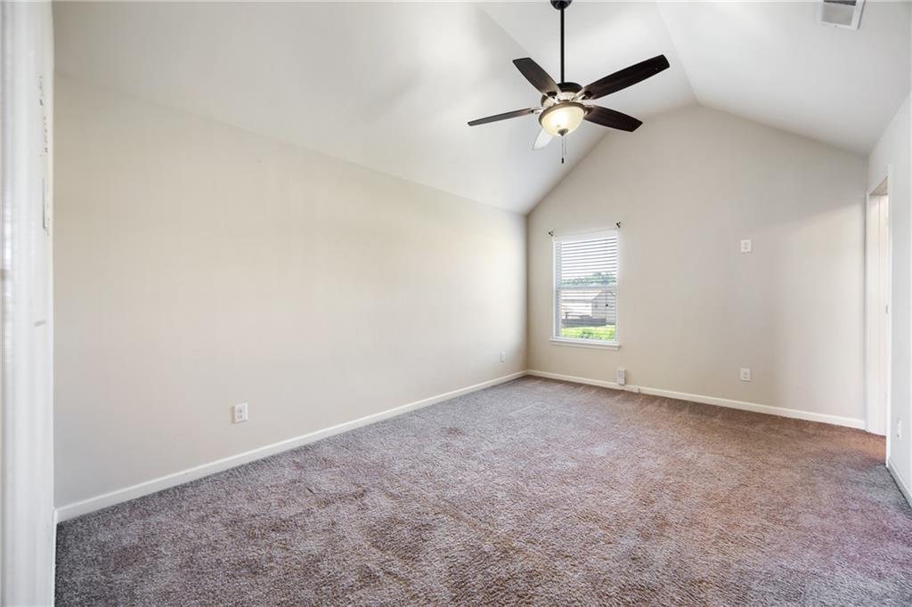 6891 Dresden Drive Rex, GA 30273 - Photo 18 of 26 a view of an empty room with a ceiling fan