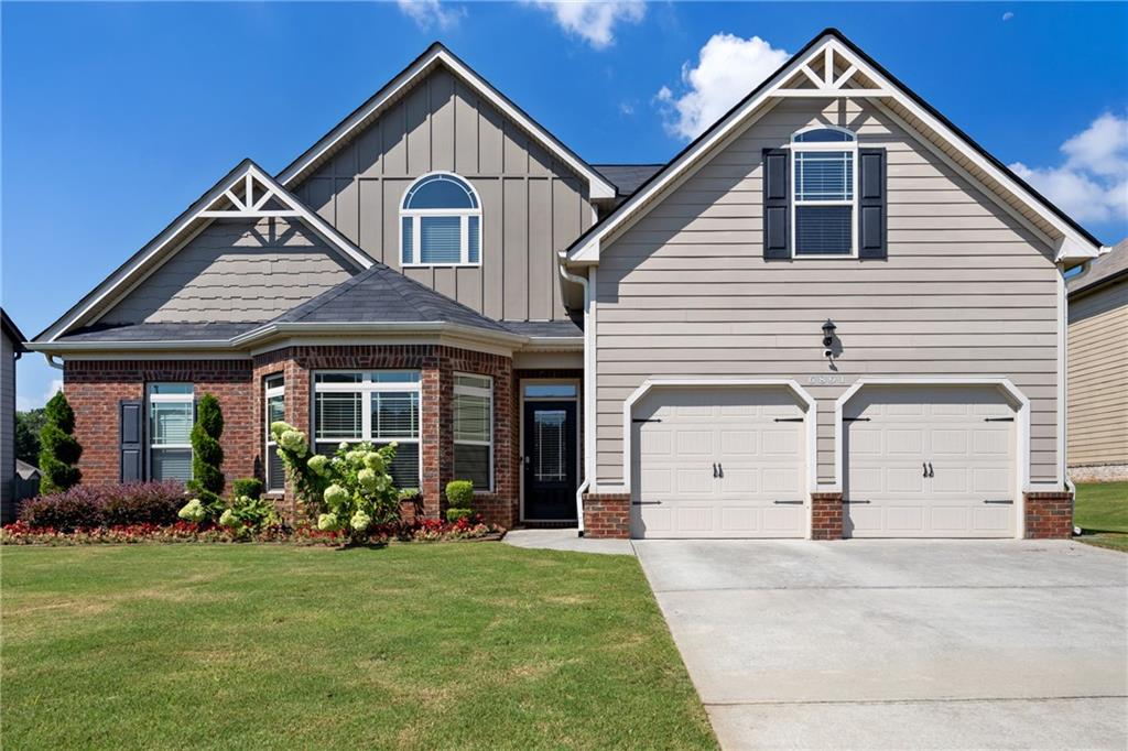 6891 Dresden Drive Rex, GA 30273 - Photo 3 of 26 a front view of a house with garden