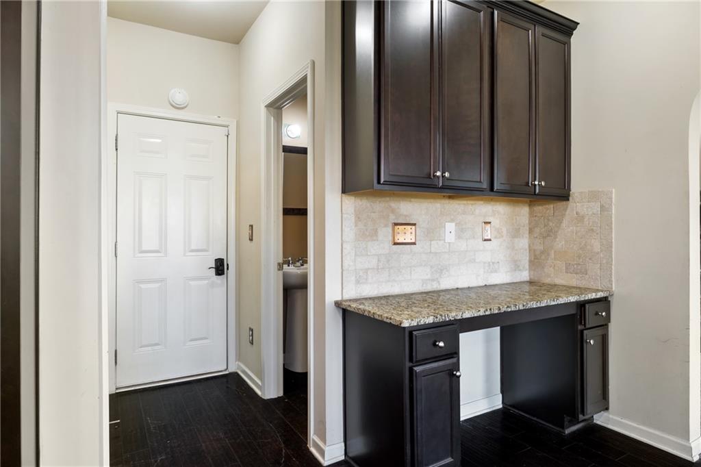 6891 Dresden Drive Rex, GA 30273 - Photo 9 of 26 a kitchen with stainless steel appliances granite countertop wooden cabinets a sink and dishwasher