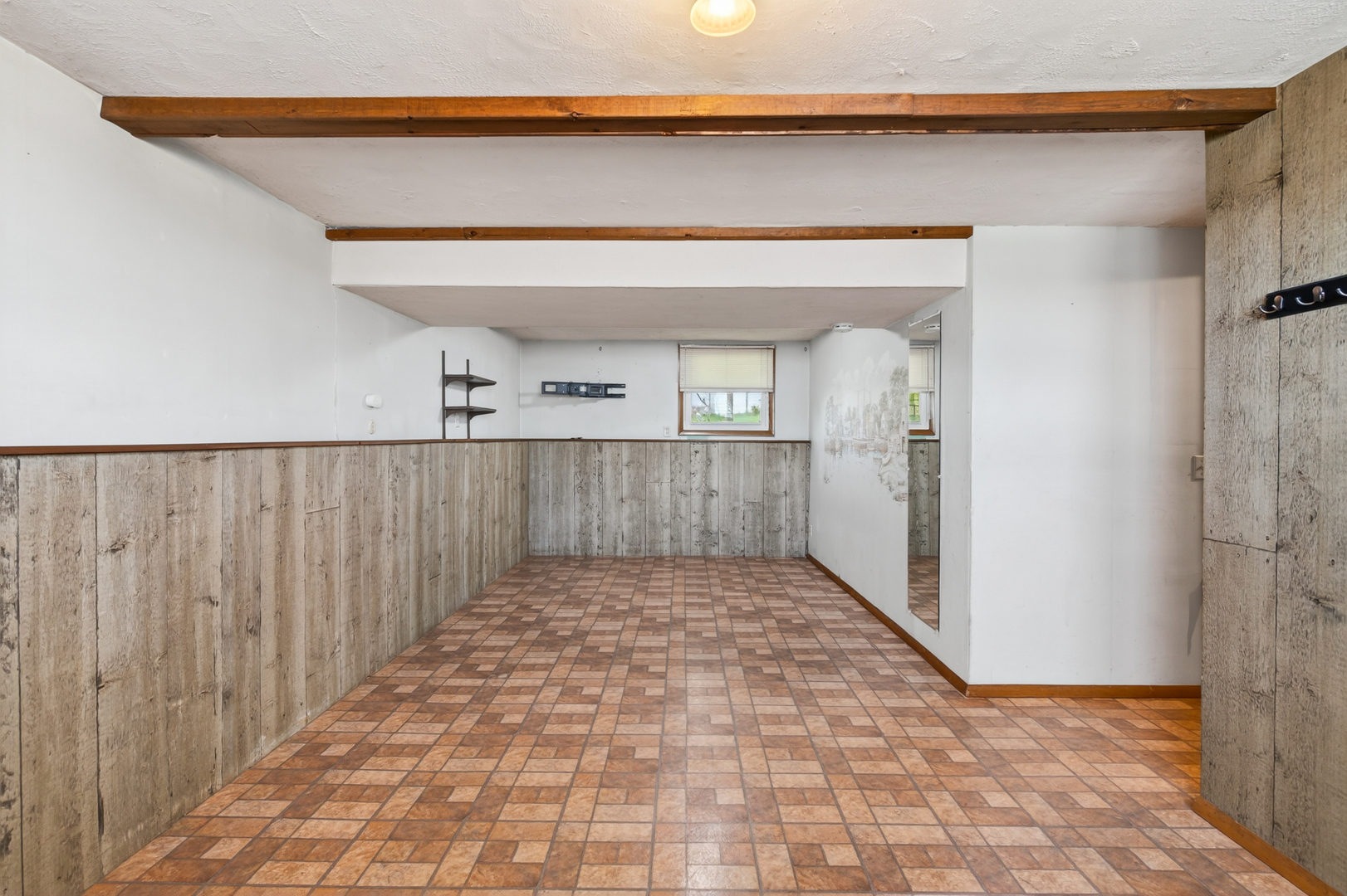 1229 13th Avenue North Clinton, IA 52732 - Photo 19 of 26 a view of a hallway with wooden floor and a bathroom