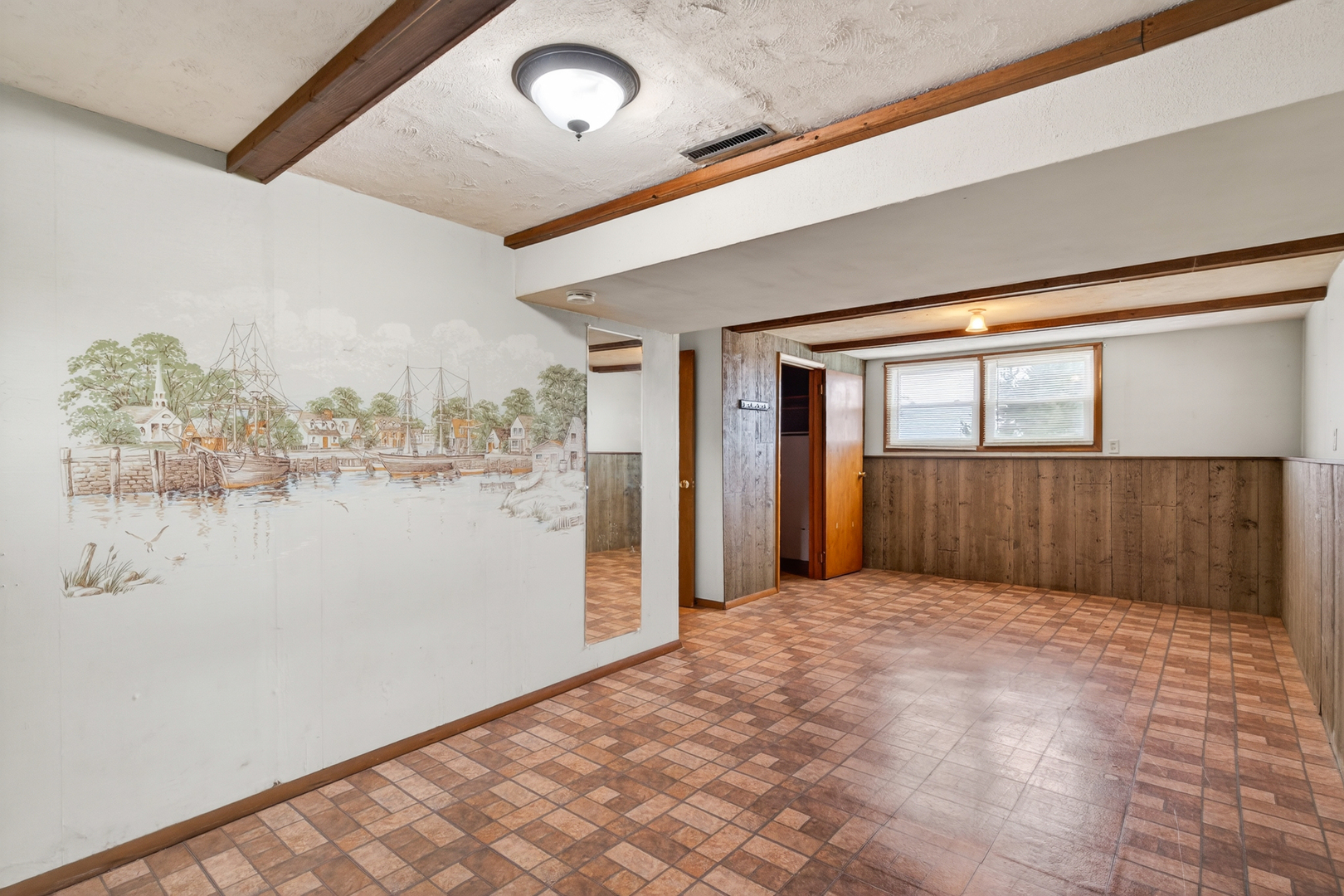 1229 13th Avenue North Clinton, IA 52732 - Photo 20 of 26 a view of a big room with wooden floor and brick walls