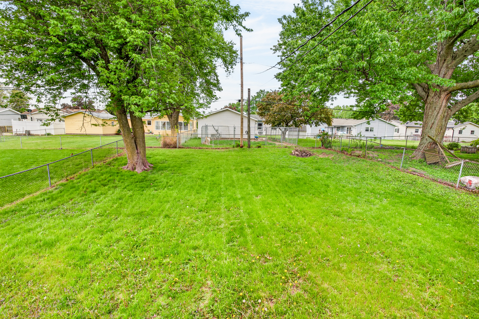 1229 13th Avenue North Clinton, IA 52732 - Photo 5 of 26 a huge green field with lots of trees