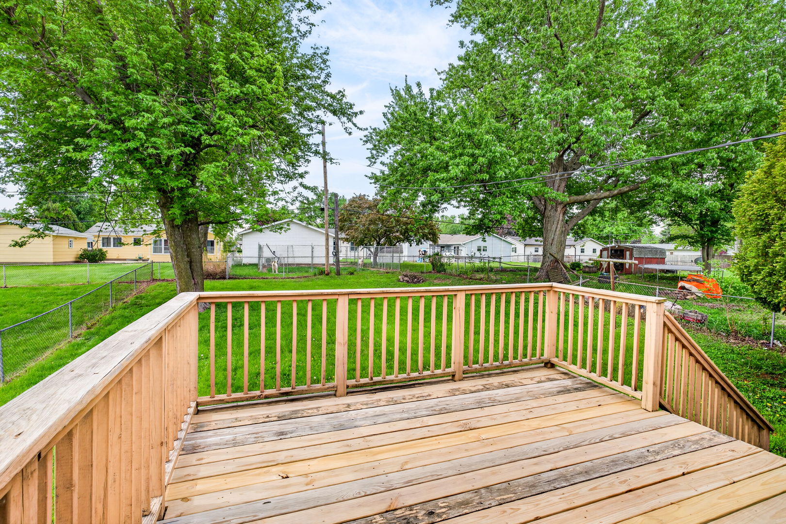 1229 13th Avenue North Clinton, IA 52732 - Photo 6 of 26 a view of deck with wooden floor and fence