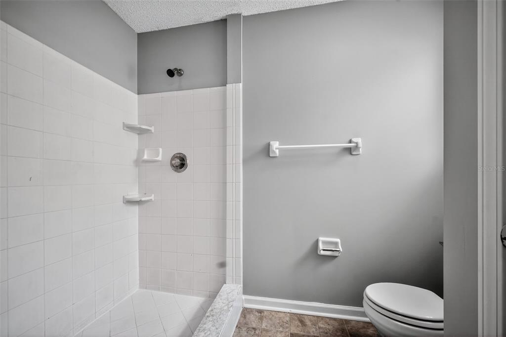 96025 Sunfish Lane Yulee, FL 32097 - Photo 15 of 17 a bathroom with a toilet and shower