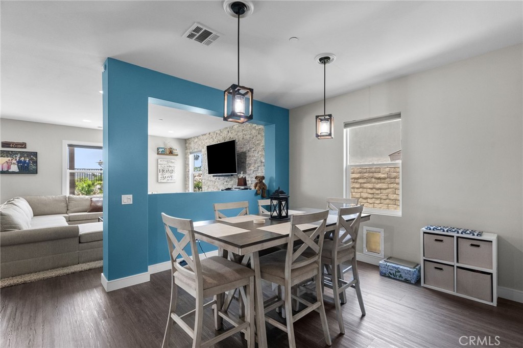 19512 Griffith Drive Saugus, CA 91350 - Photo 14 of 46 a view of a dining room with furniture window and wooden floor