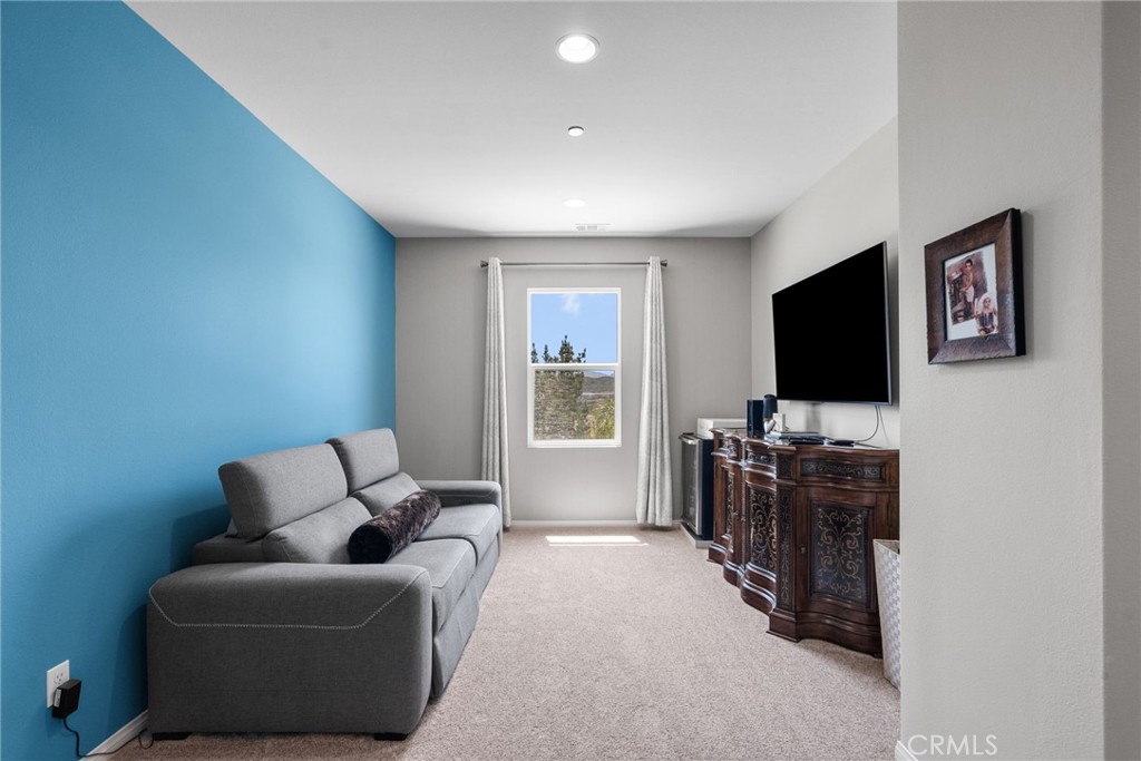 19512 Griffith Drive Saugus, CA 91350 - Photo 21 of 46 a living room with furniture and a flat screen tv