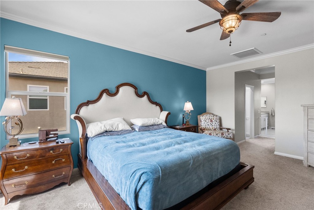 19512 Griffith Drive Saugus, CA 91350 - Photo 26 of 46 a bedroom with bed and a chandelier
