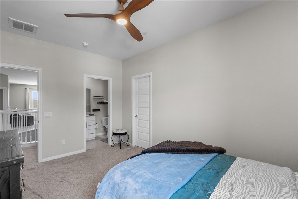 19512 Griffith Drive Saugus, CA 91350 - Photo 32 of 46 a bedroom with a bed and cabinets