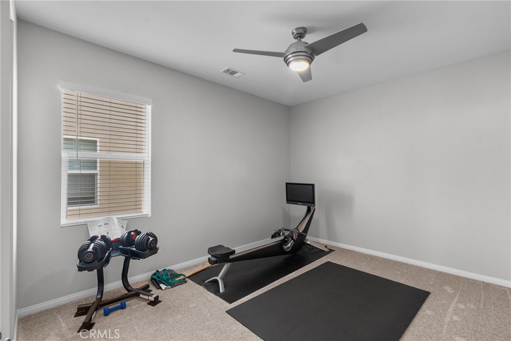 19512 Griffith Drive Saugus, CA 91350 - Photo 36 of 46 a room with gym equipment on wooden floor