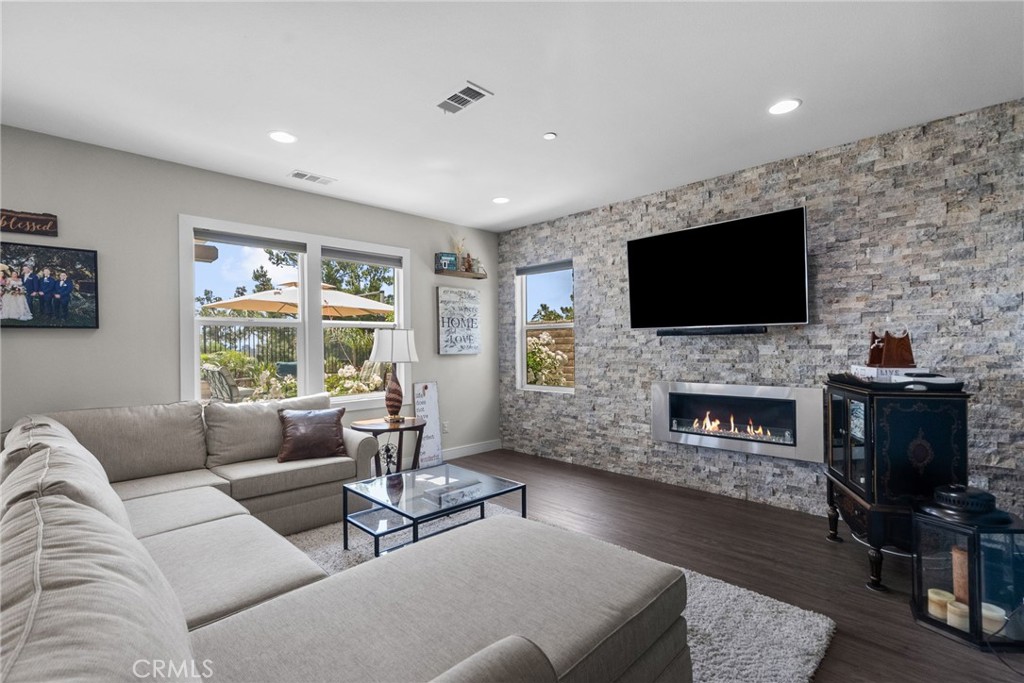 19512 Griffith Drive Saugus, CA 91350 - Photo 4 of 46 a living room with furniture a flat screen tv and a fireplace