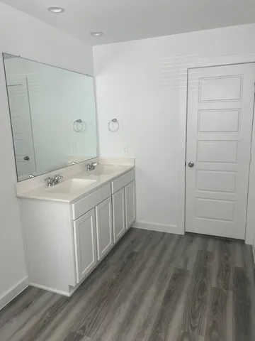 a view of cabinets with wooden floor