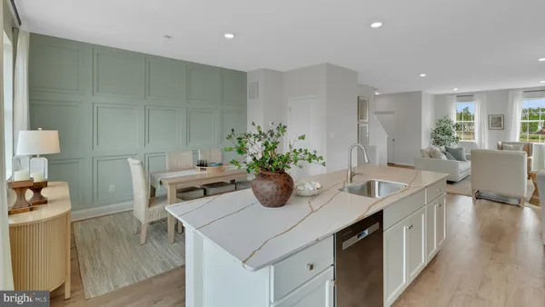 a kitchen with a sink a counter and cabinets