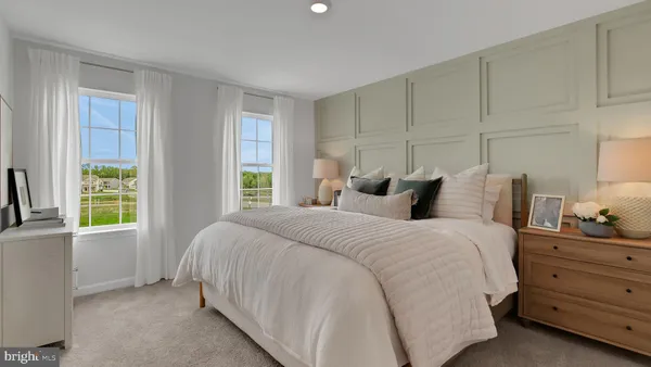 a bedroom with bed and window