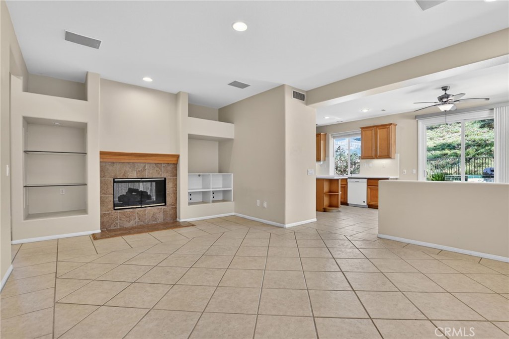 20543 Pesaro Porter Ranch Porter Ranch, CA 91326 - Photo 18 of 67 a view of an empty room with a fireplace and a window