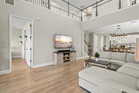 a living room with lots of furniture and white walls