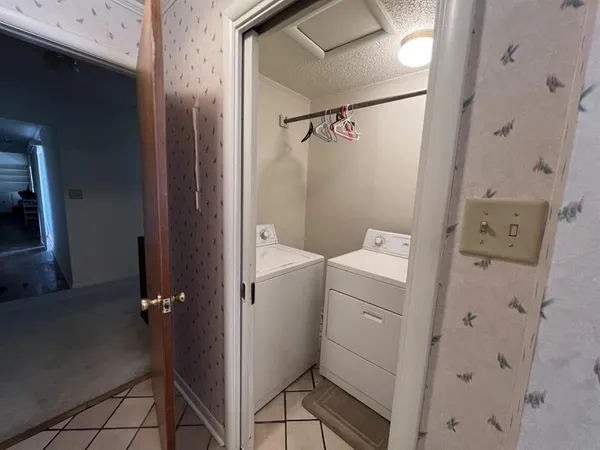 a bathroom with a shower and sink