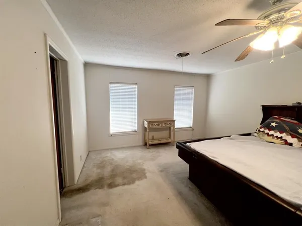 a bed room with furniture and a window