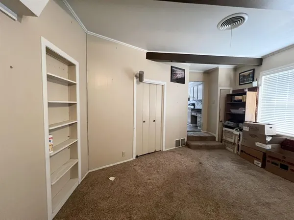 a view of a livingroom with furniture and windows