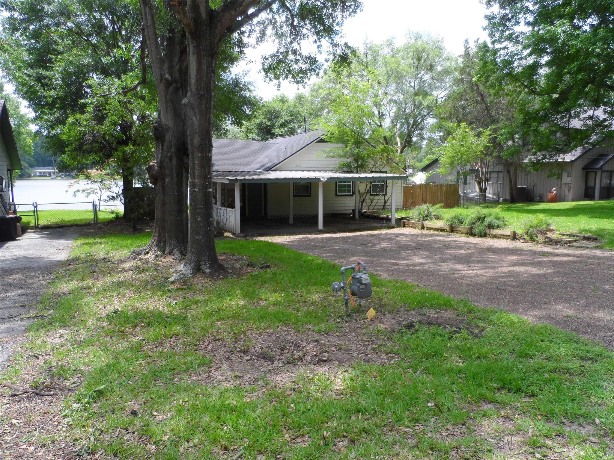 13545 Northshore Loop Conroe, TX 77304 - Photo 1 of 44 View of the carport and extra large driveway