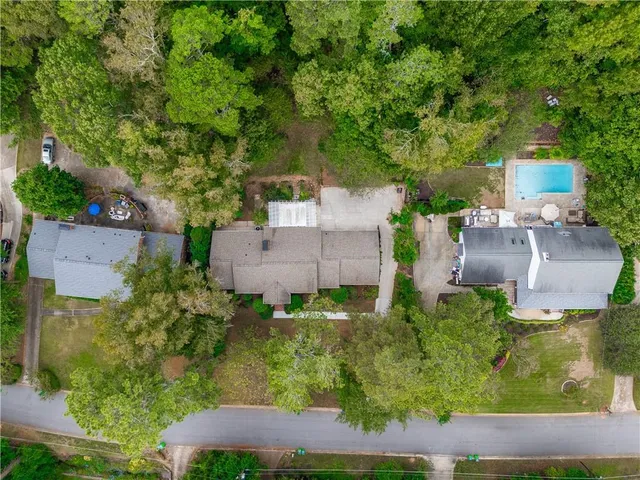 an aerial view of a house with outdoor space and street view