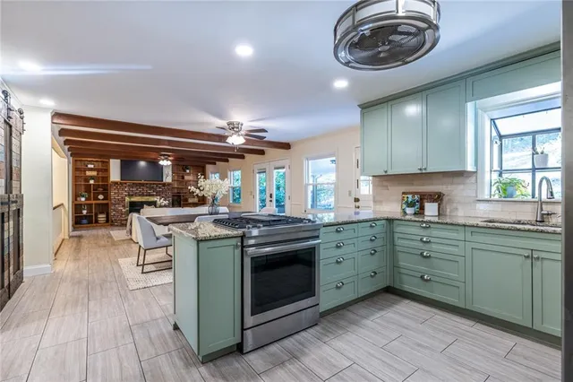 a kitchen with a stove and cabinets