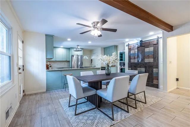 a dining room with furniture and window