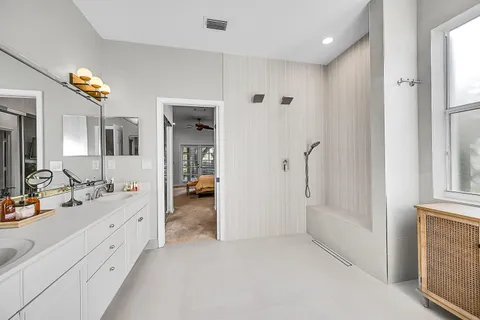 a large white room with mirror and