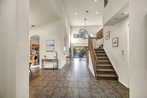 a view of a hallway with seating area