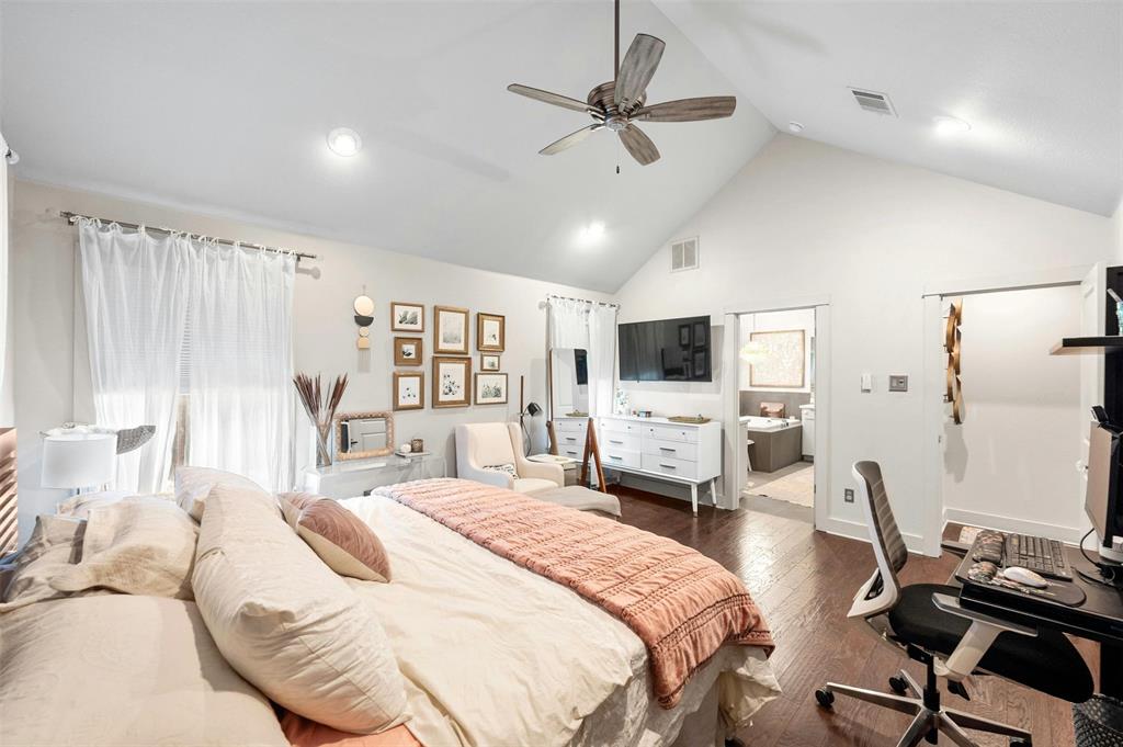 2802 Warren Street, Unit A Austin, TX 78703 - Photo 16 of 29 a bedroom with a bed a flat screen tv and a couch