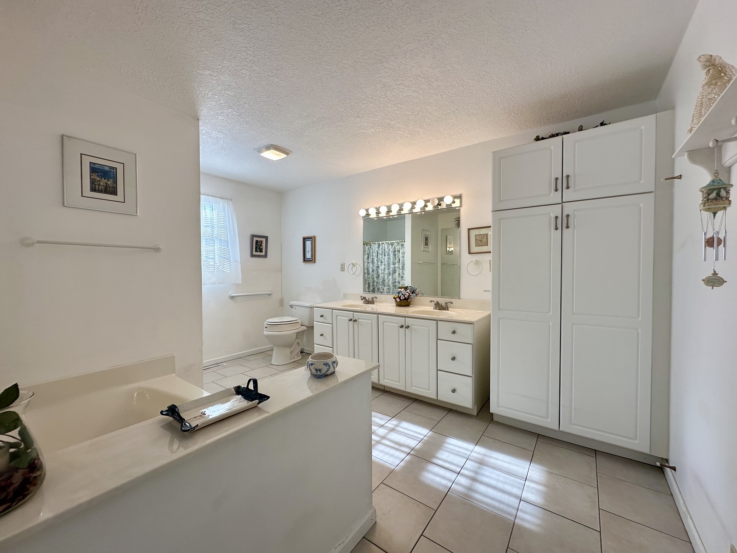 8752 Wagon Trail Road Clinton, IL 61727 - Photo 14 of 19 a room with a white cabinets and white appliances