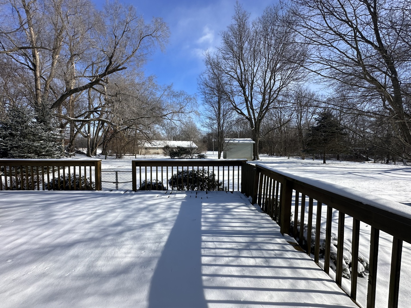 8752 Wagon Trail Road Clinton, IL 61727 - Photo 19 of 19 a view of a balcony with wooden fence