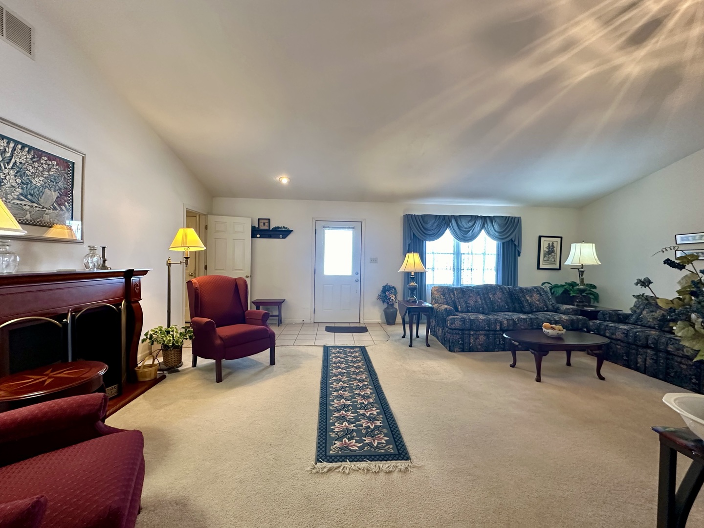 8752 Wagon Trail Road Clinton, IL 61727 - Photo 4 of 19 a living room with furniture and a fireplace